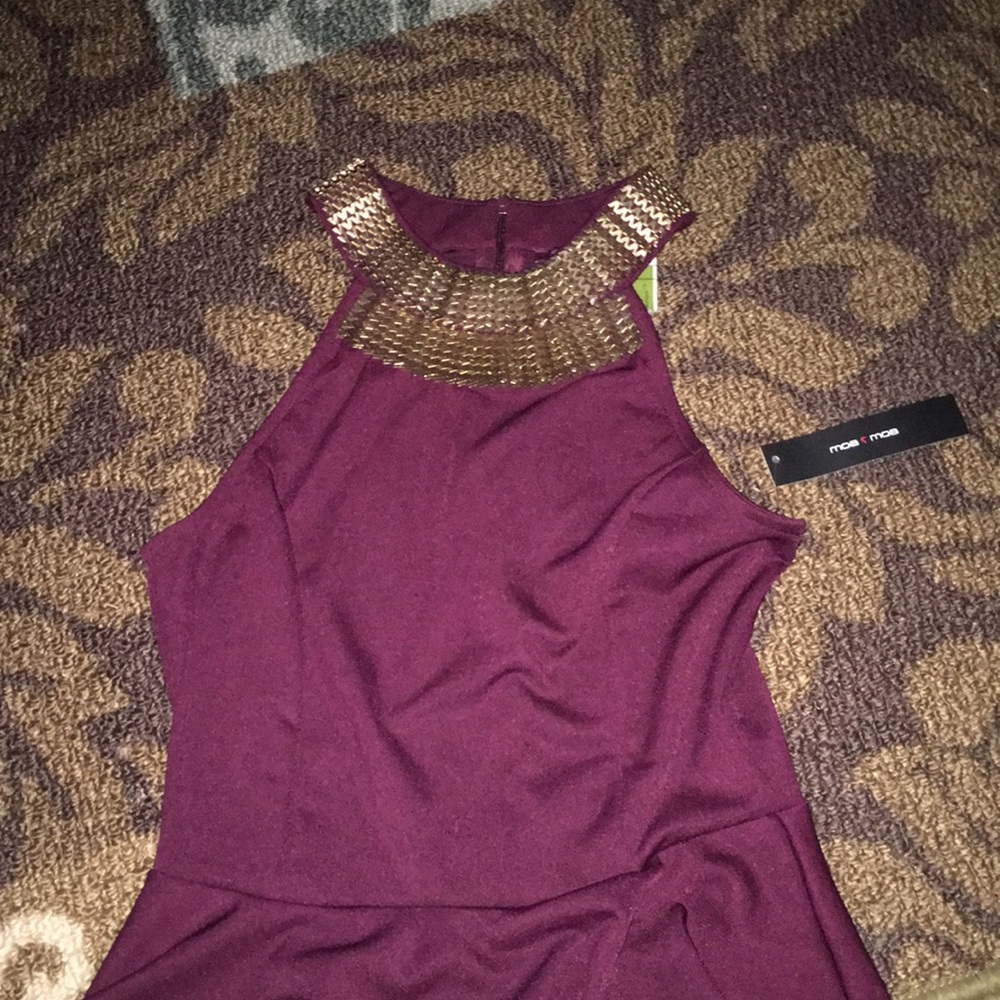 Burgundy peplum top with gold neckline